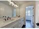 Bathroom featuring black fixtures, a double vanity, and tile floors at 1043 Middlebrooke Dr, Canton, GA 30115
