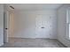 A bright bedroom with double closets, carpeted floors, and a window at 1043 Middlebrooke Dr, Canton, GA 30115