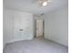 Bright bedroom with soft gray carpet and double closet doors at 1043 Middlebrooke Dr, Canton, GA 30115