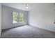 Bedroom with soft gray carpet and a window that offers a pleasant view at 1043 Middlebrooke Dr, Canton, GA 30115