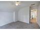Neutral bedroom featuring carpet, a window for natural light, and an open doorway at 1043 Middlebrooke Dr, Canton, GA 30115