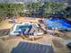 Aerial view of the community center showcasing the pool, tennis courts, playground, and parking at 1043 Middlebrooke Dr, Canton, GA 30115