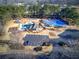 Aerial view of the community center with pool, tennis courts, playground, and ample parking spaces at 1043 Middlebrooke Dr, Canton, GA 30115