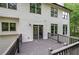 A close-up view of a spacious deck with a door leading inside the home at 1043 Middlebrooke Dr, Canton, GA 30115