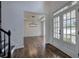 Bright foyer with dark wood floors, white walls, stairs and a front door with sidelights at 1043 Middlebrooke Dr, Canton, GA 30115