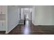 Bright foyer with hardwood floors, staircase, and an open floor plan at 1043 Middlebrooke Dr, Canton, GA 30115