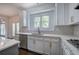 Bright kitchen with stainless steel appliances, ample cabinetry, and hardwood floors at 1043 Middlebrooke Dr, Canton, GA 30115