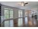 Bright living room with built-in shelves, fireplace, and view to the kitchen at 1043 Middlebrooke Dr, Canton, GA 30115