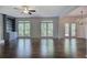 Spacious living room with ceiling fan, access to back deck, hardwood floors at 1043 Middlebrooke Dr, Canton, GA 30115