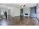 Bright living room with fireplace, built-in shelves, and hardwood flooring at 1043 Middlebrooke Dr, Canton, GA 30115