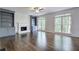 Spacious living room featuring a fireplace with built-in bookcases and two large windows at 1043 Middlebrooke Dr, Canton, GA 30115