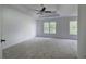 Elegant main bedroom with tray ceilings, plush carpeting, and scenic backyard views at 1043 Middlebrooke Dr, Canton, GA 30115