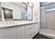 Modern bathroom with double sink vanity, large mirror, and glass-enclosed shower at 151 Flat Shoals Ave # 13, Atlanta, GA 30316