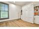 Bedroom featuring hardwood floors and a white murphy bed with surrounding shelving at 151 Flat Shoals Ave # 13, Atlanta, GA 30316