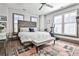 Bedroom with patterned headboard, ceiling fan, neutral color scheme, and a patterned rug at 151 Flat Shoals Ave # 13, Atlanta, GA 30316
