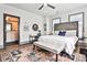 Bedroom with patterned headboard, ceiling fan, neutral color scheme, and a patterned rug at 151 Flat Shoals Ave # 13, Atlanta, GA 30316