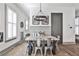 Dining room features a wooden table, metal chairs, bench seating, and a modern light fixture at 151 Flat Shoals Ave # 13, Atlanta, GA 30316