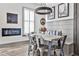 Dining room with wood table, metal chairs, bench seating, modern light fixture, and decor at 151 Flat Shoals Ave # 13, Atlanta, GA 30316