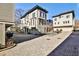 Exterior view of townhomes with private entrances, attached garages, and a neatly paved driveway at 151 Flat Shoals Ave # 13, Atlanta, GA 30316