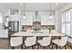 Modern kitchen with stainless steel appliances, a breakfast bar, and designer pendant lighting at 151 Flat Shoals Ave # 13, Atlanta, GA 30316