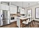 Modern kitchen with stainless steel appliances, a breakfast bar, and designer pendant lighting at 151 Flat Shoals Ave # 13, Atlanta, GA 30316