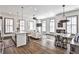 An open-concept living space featuring hardwood floors, a kitchen island, and plenty of natural light from the windows at 151 Flat Shoals Ave # 13, Atlanta, GA 30316