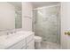 Well-lit bathroom featuring a marble tiled glass shower and a marble vanity at 1916 Oakwood Grove Dr, Snellville, GA 30078