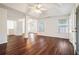 Spacious main bedroom with high ceilings, ceiling fan, beautiful hardwood floors, and abundant natural light at 1916 Oakwood Grove Dr, Snellville, GA 30078