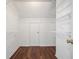 Walk-in closet featuring white walls and metal shelving for ample storage at 1916 Oakwood Grove Dr, Snellville, GA 30078