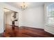 Elegant dining room with hardwood floors, decorative moldings, and easy access to the kitchen at 1916 Oakwood Grove Dr, Snellville, GA 30078