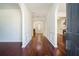 Inviting foyer with gleaming hardwood floors, arched doorways, and views of the fireplace at 1916 Oakwood Grove Dr, Snellville, GA 30078