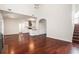 Open-concept living room with high ceilings and hardwood floors, connecting seamlessly to the kitchen at 1916 Oakwood Grove Dr, Snellville, GA 30078