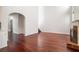 Spacious living room featuring hardwood floors, a brick fireplace, and an open layout at 1916 Oakwood Grove Dr, Snellville, GA 30078