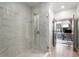 Modern bathroom with frameless glass shower featuring white tile at 383 Pratt Se Dr # 504, Atlanta, GA 30315