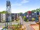 Aerial view of a townhome community featuring modern architecture, landscaping, and street views at 383 Pratt Se Dr # 504, Atlanta, GA 30315