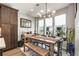 Dining area featuring a large dining table, chairs, bench seating, and natural light from large windows at 383 Pratt Se Dr # 504, Atlanta, GA 30315