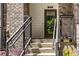 Close-up of steps and stylish railings lead to a welcoming townhome entrance at 383 Pratt Se Dr # 504, Atlanta, GA 30315
