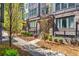 Charming townhome exteriors display brick accents, landscaped yards, and inviting walkways under a sunny sky at 383 Pratt Se Dr # 504, Atlanta, GA 30315