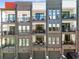 Modern townhome exterior with multiple floors, balconies, and individual garages showcasing contemporary design at 383 Pratt Se Dr # 504, Atlanta, GA 30315