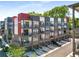 Modern townhome exterior featuring a brick facade, balconies, and attached garages for convenient parking at 383 Pratt Se Dr # 504, Atlanta, GA 30315