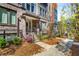 Beautiful townhome showcases brick facade, landscaped front yard, and inviting entryway with steps at 383 Pratt Se Dr # 504, Atlanta, GA 30315