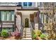 Inviting townhome entrance features steps, a covered porch, and beautifully landscaped surroundings at 383 Pratt Se Dr # 504, Atlanta, GA 30315