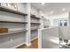 Upstairs hallway with dark wood-look shelves and wooden floors at 383 Pratt Se Dr # 504, Atlanta, GA 30315