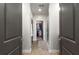 Hallway leading to primary closet and shower, featuring wood floors and neutral color scheme at 383 Pratt Se Dr # 504, Atlanta, GA 30315