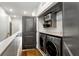 Convenient laundry area with modern washer and dryer, plus storage space at 383 Pratt Se Dr # 504, Atlanta, GA 30315