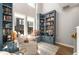 Bright library nook with built-in blue shelving, window seat, and comfortable armchair at 383 Pratt Se Dr # 504, Atlanta, GA 30315