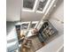 Aerial shot of the library shows custom bookcases, a window seat, and stylish decor at 383 Pratt Se Dr # 504, Atlanta, GA 30315