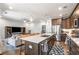 Open concept living space with kitchen island, seating, and entertainment center at 383 Pratt Se Dr # 504, Atlanta, GA 30315