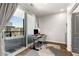 Bright home office with desk, chair, and sliding door to a balcony at 383 Pratt Se Dr # 504, Atlanta, GA 30315
