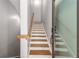 Elegant wooden staircase leads to the upper floors, bathed in natural light at 383 Pratt Se Dr # 504, Atlanta, GA 30315